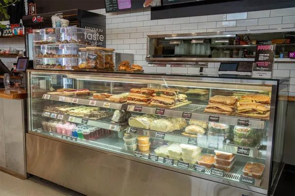 Dough Bros counter — cookies, the case, the pink mark