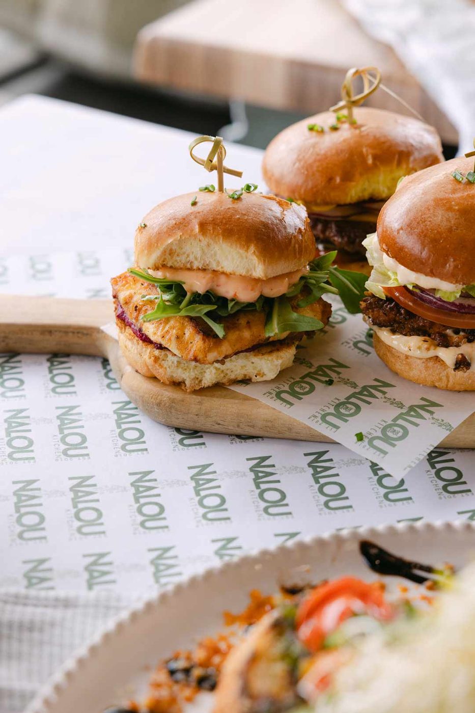 Nalou Kitchen sliders on branded paper